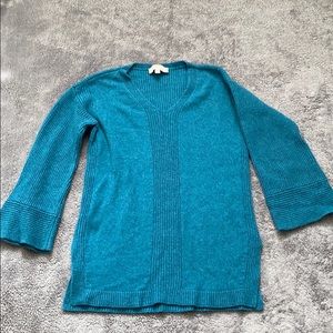 Blue left sweater